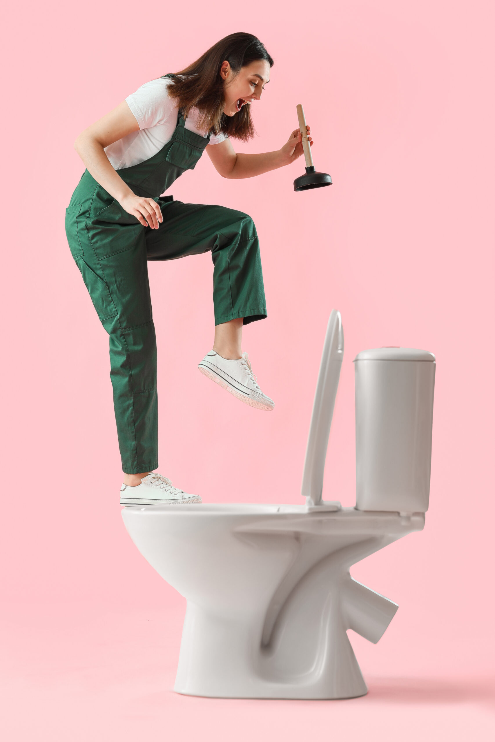 female plumber with toilet